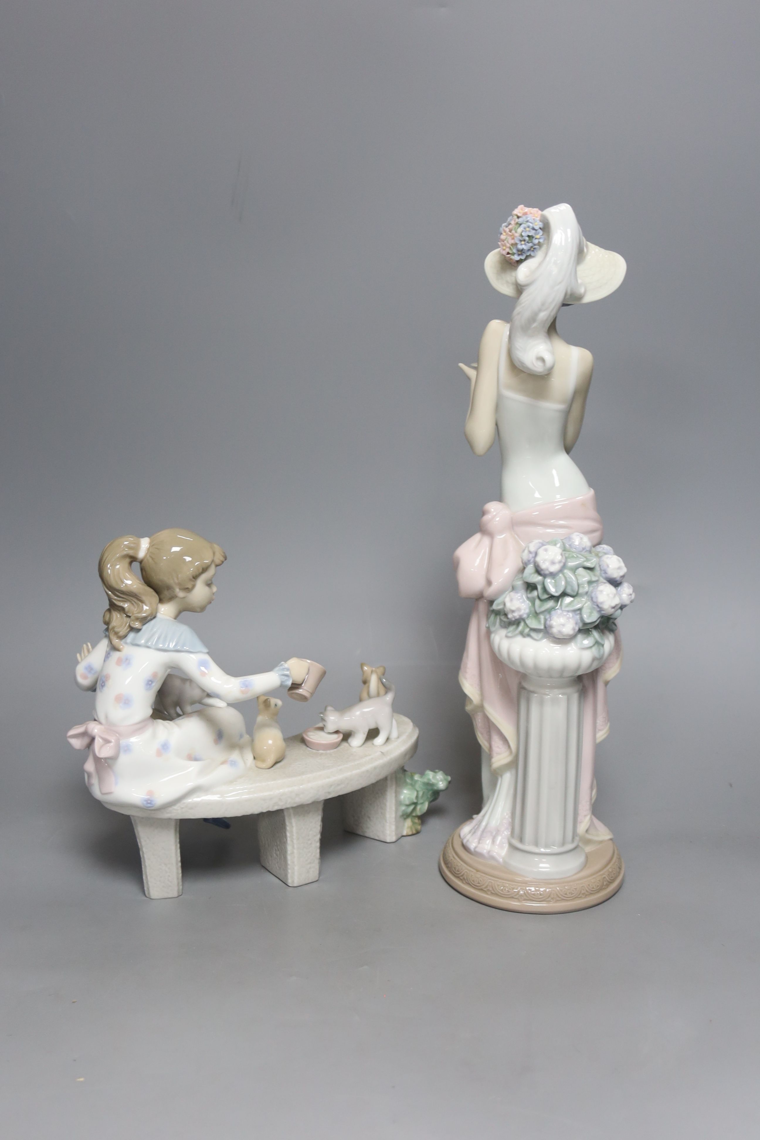 A Lladro figure, 'Tea Time', no. 5470 and another, 'Meal Time,' no. 6109 H 37cm (largest)